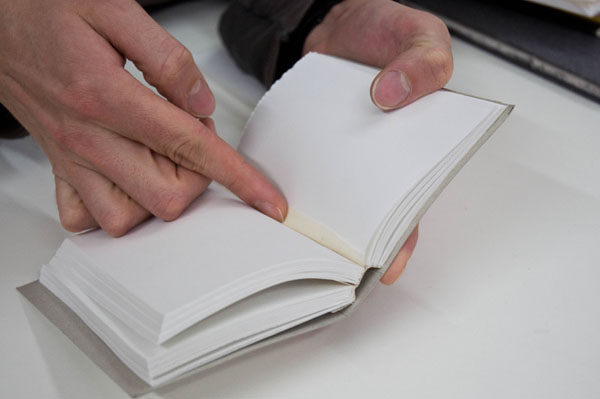 Jack points out the scrim in the reusable notebook